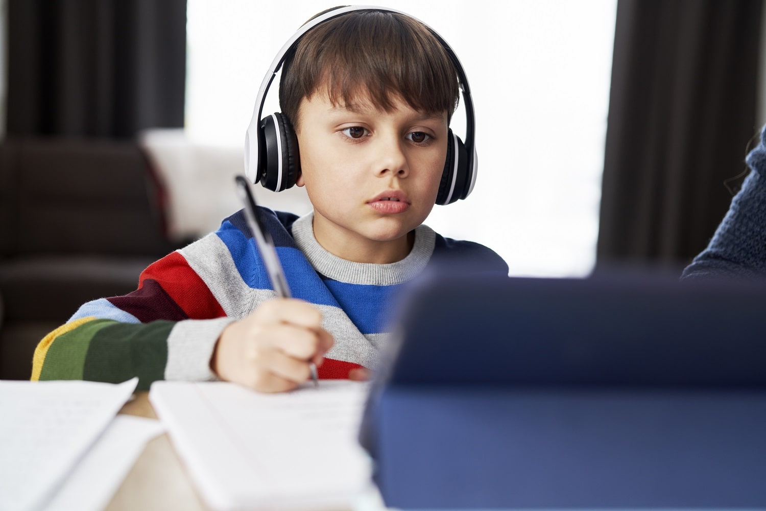 boy-in-headphone-during-homeschooling-2021-08-31-22-23-55-utc-min